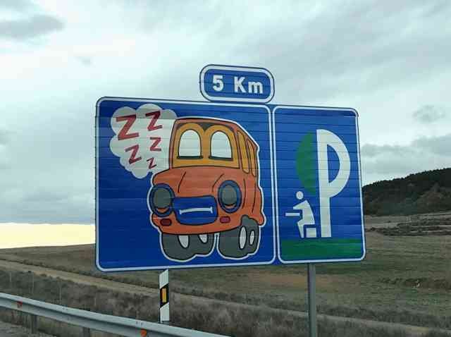 A fun road-sign on the motorway in Spain .. don't fall asleep in the car, pull in to a picnic area!